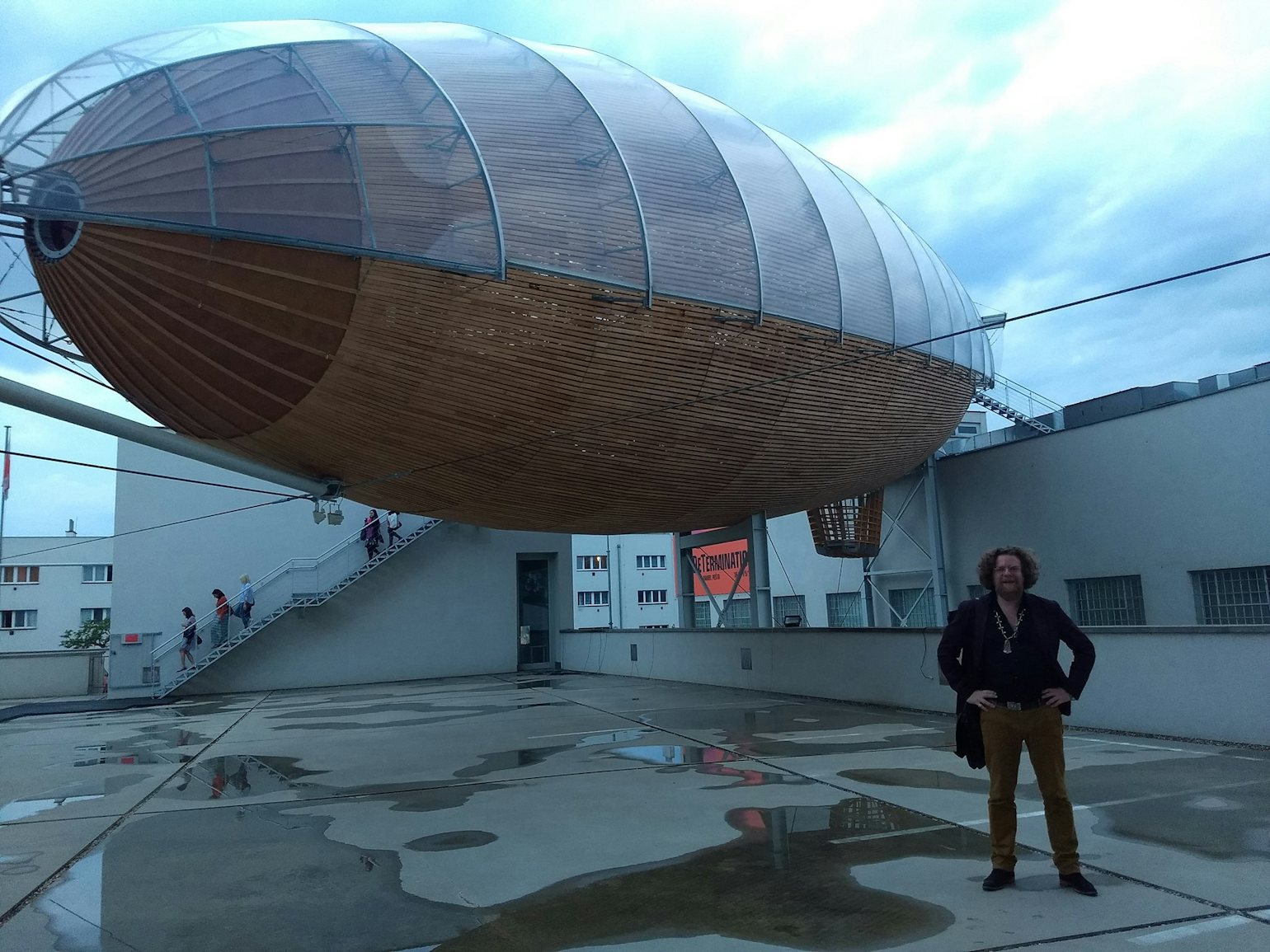 The author of 'WILL' in front of the airship-shaped reading room of the DOX Centre. Photo © Jeroen Olyslaegers